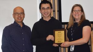 Tianjian Yang receives the Samuel J. Huang Graduate Student Research Award from Dr. Yao Lin (left) and Dr. Kelly Burke (right)