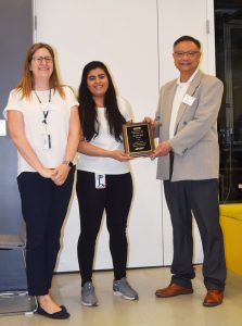 Sanyukta Patil (center) receives the Stephanie H. Shaw Scholarship from Polymer Program Director Mu-Ping Nieh (right) and former Polymer Program Director Kelly Burk (left)