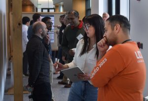 Yasmin Bimbatti and Mahdad Mahmoudi discuss research poster